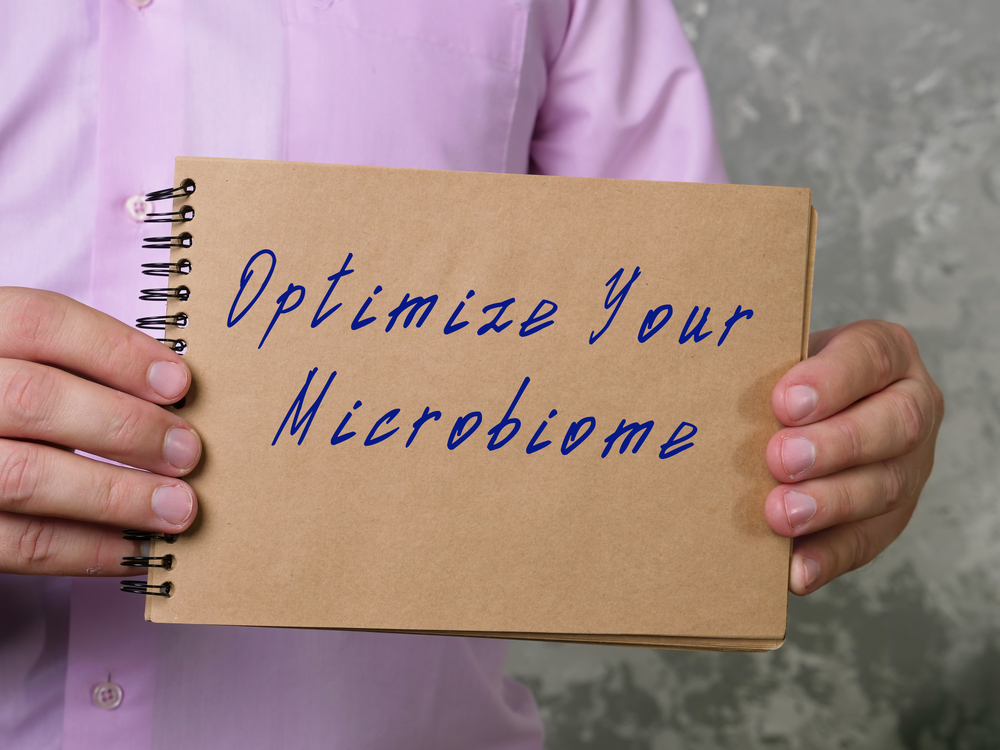 doc holding a sign for microbiome optimization in Silver Spring