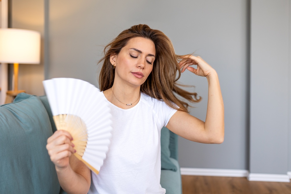 woman with symptoms caused by a hormone imbalance